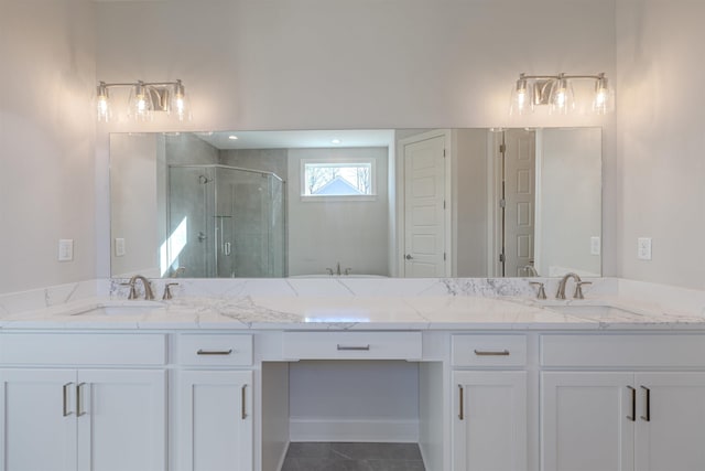 bathroom featuring an enclosed shower, vanity, and tile patterned flooring