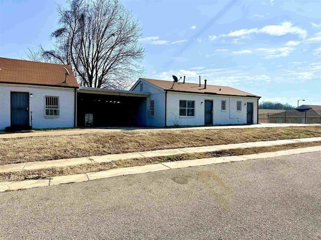 ranch-style home featuring a carport