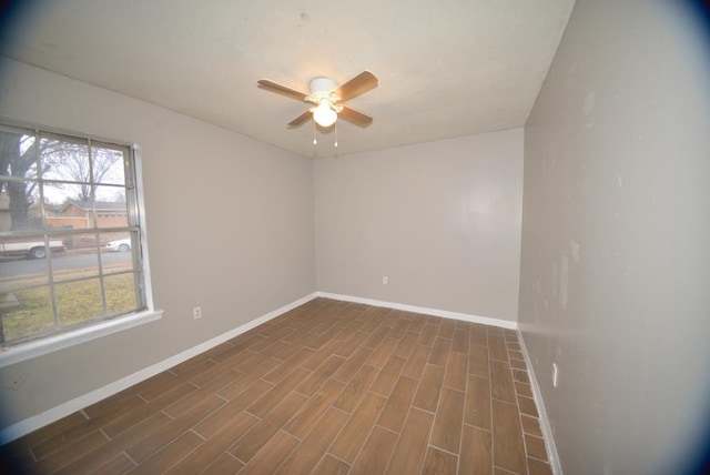 unfurnished room with ceiling fan and dark hardwood / wood-style floors