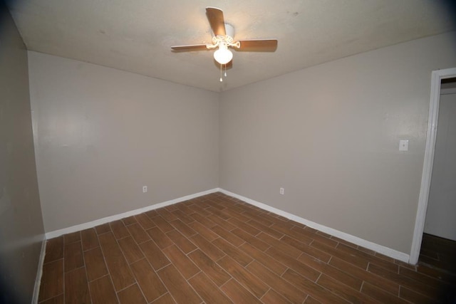 unfurnished room featuring dark hardwood / wood-style floors and ceiling fan