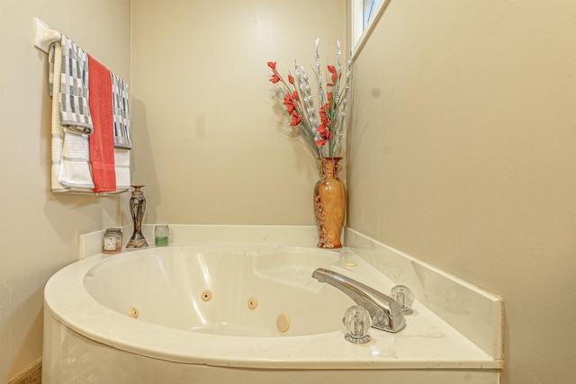 bathroom with tiled tub