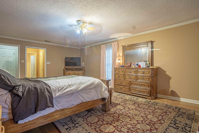 bedroom featuring crown molding, wood-type flooring, a textured ceiling, and ceiling fan