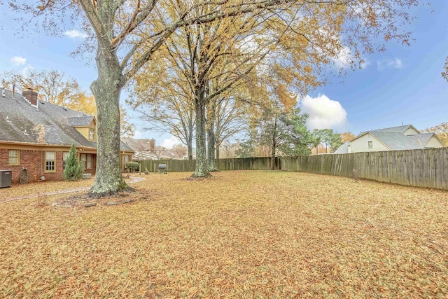 view of yard with central AC