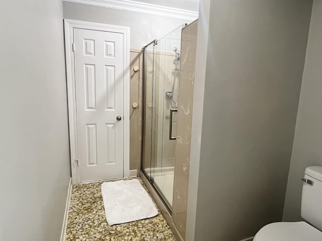 bathroom featuring toilet and walk in shower