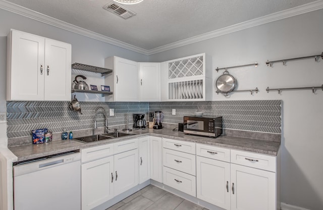 kitchen featuring white cabinets, a textured ceiling, white dishwasher, and sink