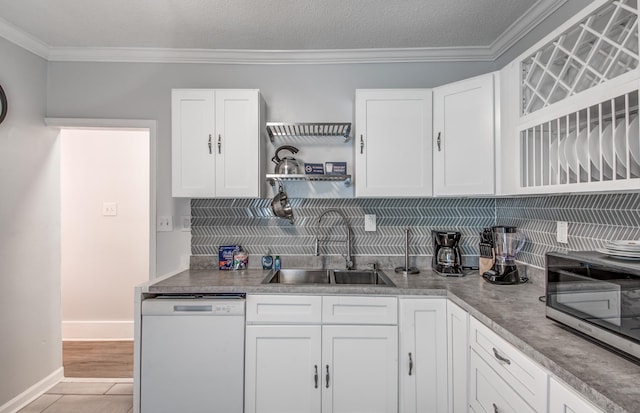 kitchen featuring white cabinets, dishwasher, and sink