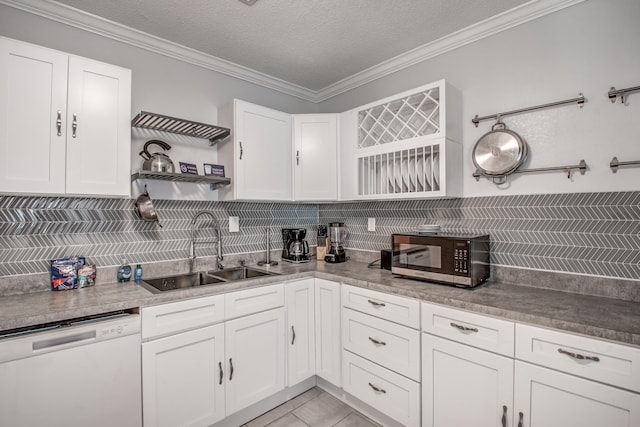 kitchen with dishwasher, white cabinetry, crown molding, and sink