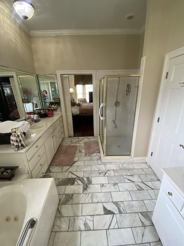 bathroom featuring vanity, ornamental molding, and independent shower and bath