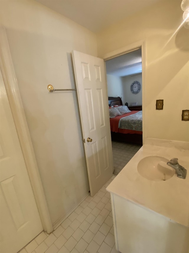 bathroom featuring tile patterned flooring and vanity