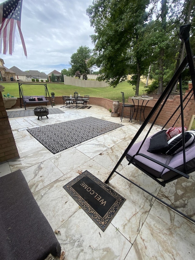 view of patio with an outdoor fire pit