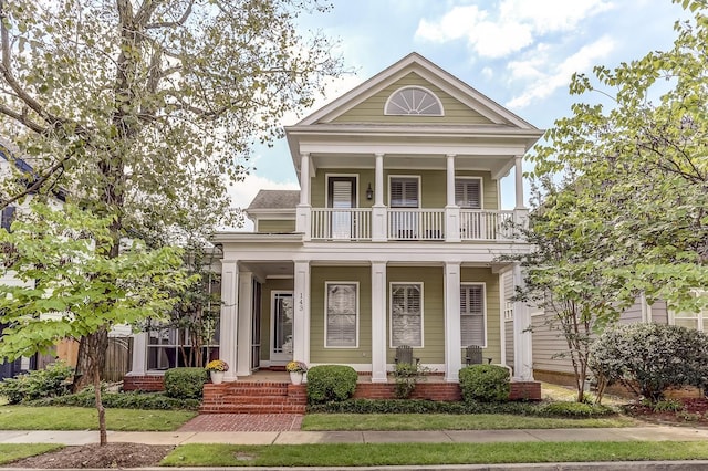 greek revival inspired property featuring a balcony