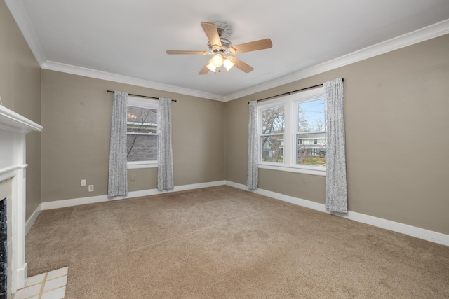 empty room with light colored carpet, ceiling fan, and ornamental molding