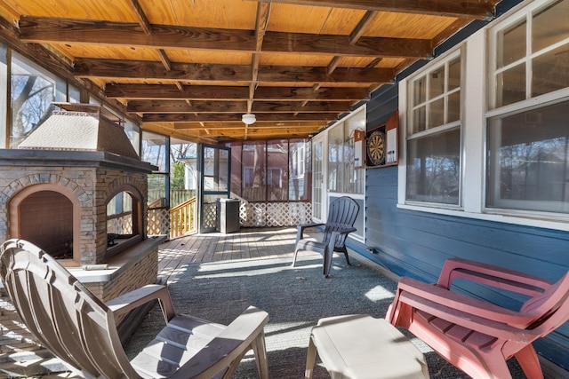 view of patio with exterior fireplace