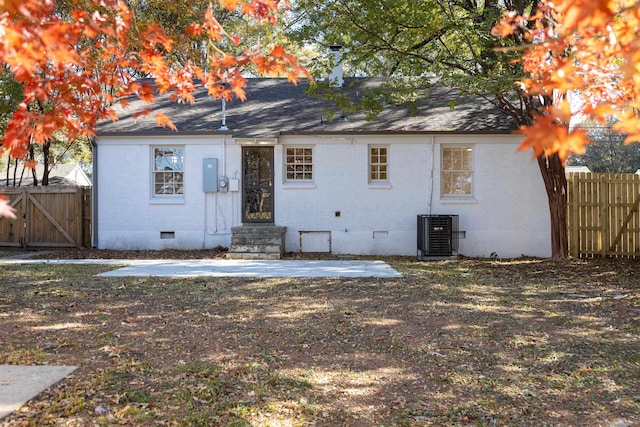 rear view of house featuring central air condition unit and a patio area