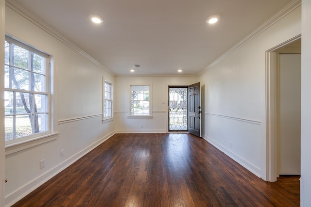 foyer with crown molding and dark hardwood / wood-style floors