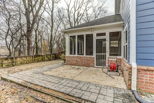 view of patio / terrace featuring a sunroom