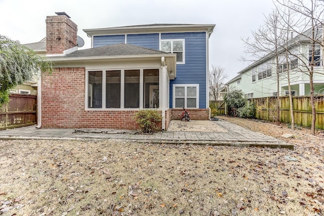 back of property with a patio