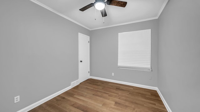 spare room with hardwood / wood-style floors, ceiling fan, and ornamental molding