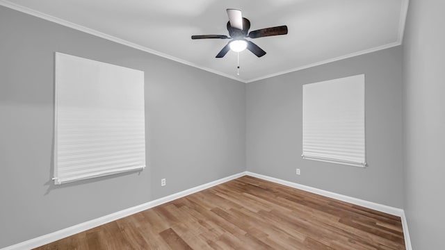 unfurnished room featuring hardwood / wood-style flooring, ceiling fan, and ornamental molding