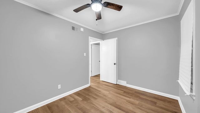 unfurnished bedroom featuring ceiling fan, light hardwood / wood-style flooring, and ornamental molding