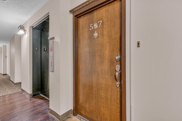 doorway to property featuring elevator