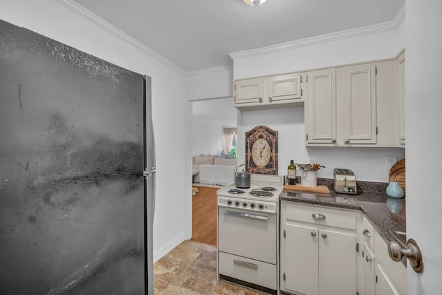 kitchen featuring black refrigerator, white range, white cabinets, and crown molding