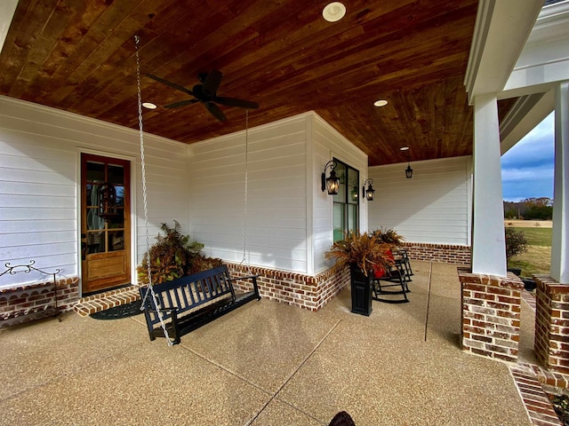 view of patio / terrace with ceiling fan and a porch