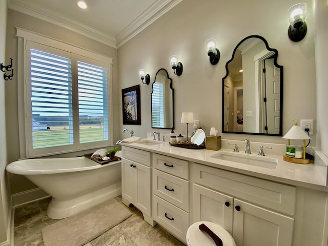 bathroom with a bathing tub, vanity, and crown molding