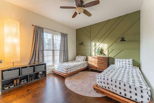 bedroom featuring ceiling fan and dark hardwood / wood-style flooring