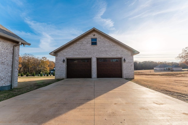 view of home's exterior with a garage and an outdoor structure