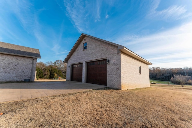 garage featuring a yard