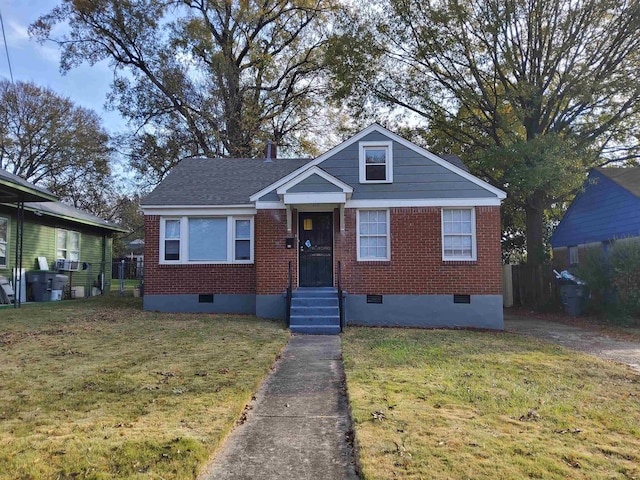 bungalow-style home with a front yard