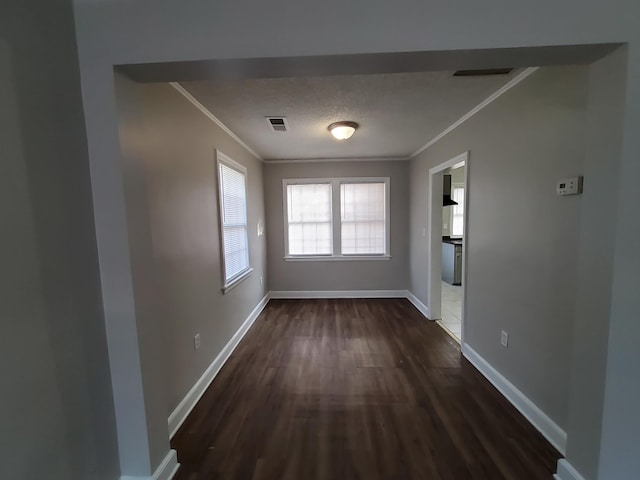 interior space with dark hardwood / wood-style flooring and crown molding