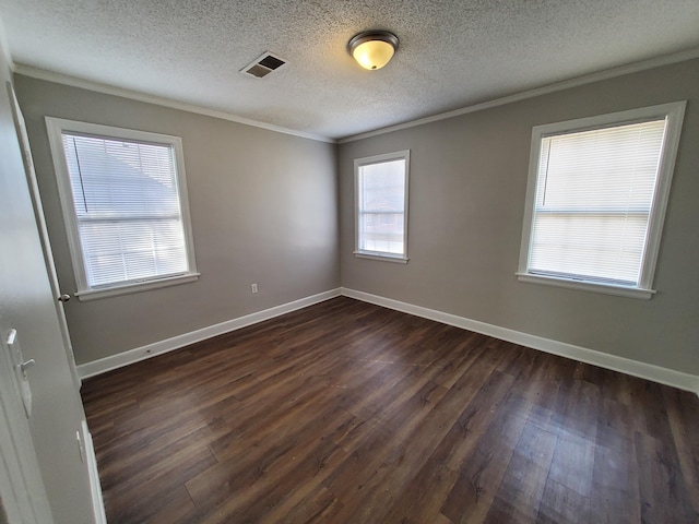 unfurnished room with dark hardwood / wood-style flooring, a textured ceiling, and ornamental molding