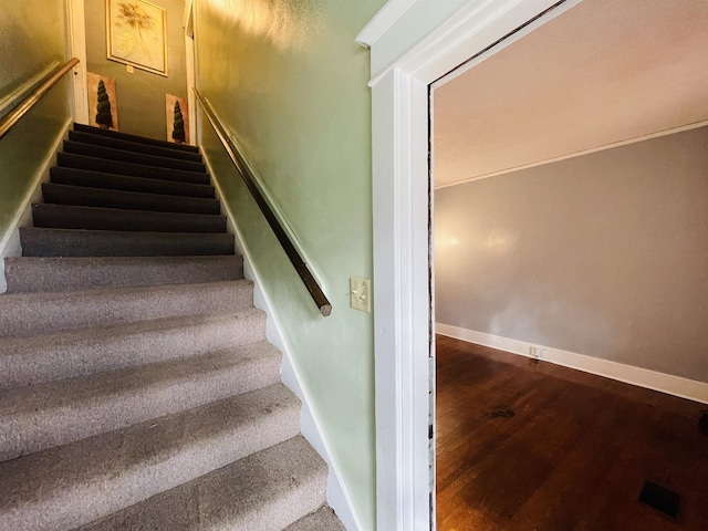 staircase featuring hardwood / wood-style flooring