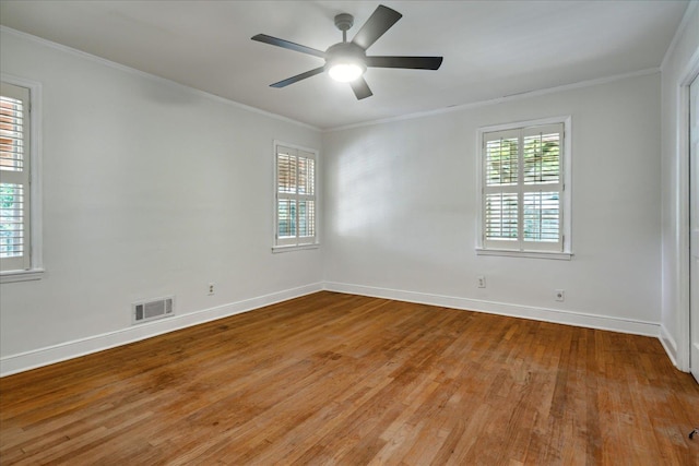 spare room with light wood-type flooring, ceiling fan, and ornamental molding