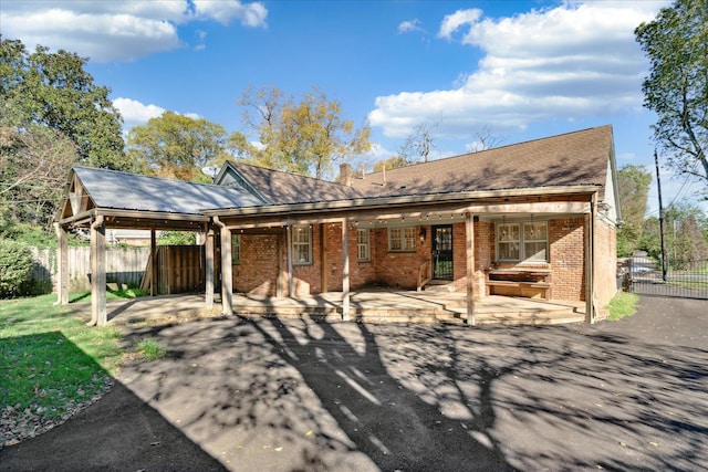 back of property with a patio