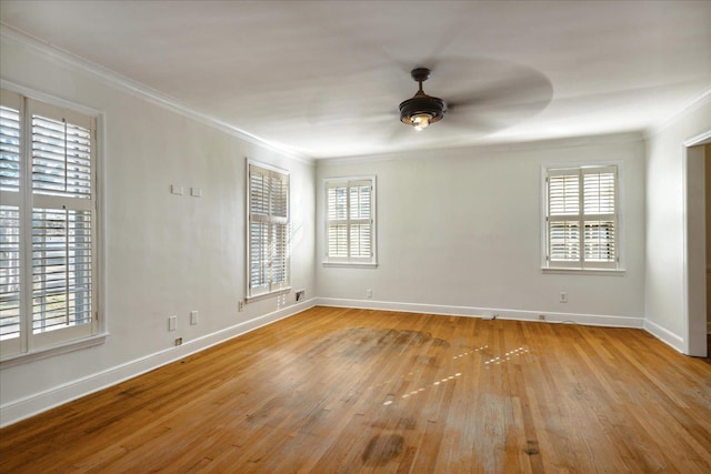 spare room featuring ceiling fan, light wood-type flooring, and ornamental molding