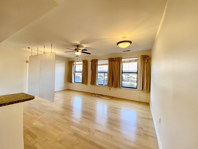 720 Litty Ct Unit 102, Memphis, TN 38103 - unfurnished living room featuring ceiling fan and light hardwood / wood-style floors