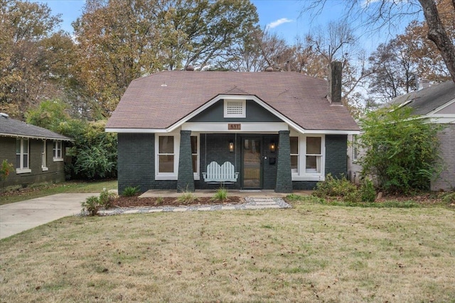 view of front of property with a front lawn and a porch