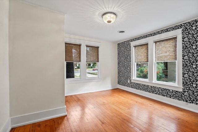 unfurnished room featuring hardwood / wood-style flooring