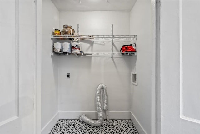 laundry room featuring electric dryer hookup, tile patterned floors, and washer hookup