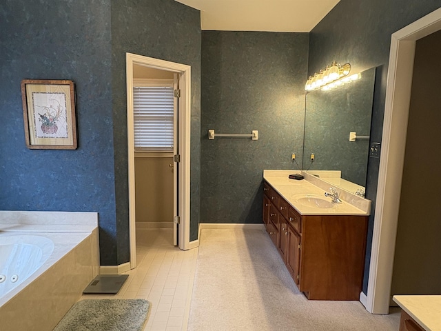 bathroom with tile patterned flooring, vanity, and a bath