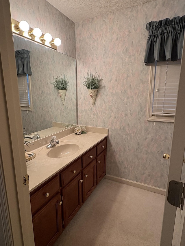 bathroom featuring vanity and a textured ceiling