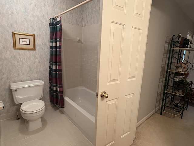 bathroom with tile patterned floors, shower / bath combo, and toilet