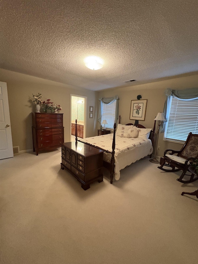 carpeted bedroom with a textured ceiling