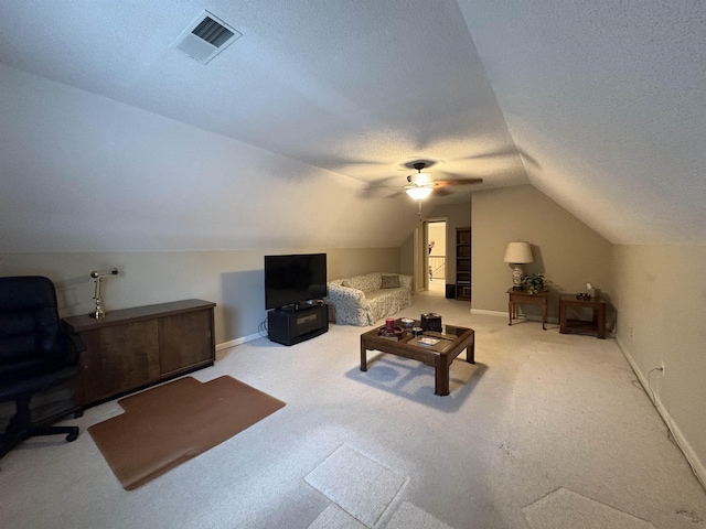 interior space with carpet flooring, a textured ceiling, ceiling fan, and lofted ceiling