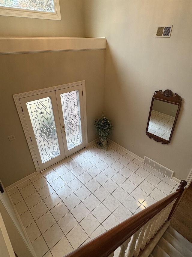 tiled foyer with french doors