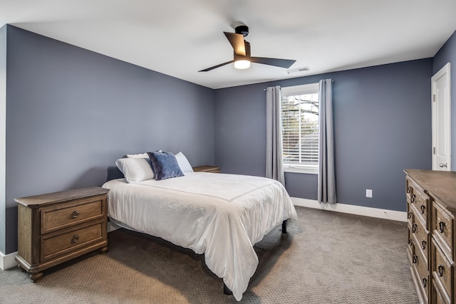 bedroom featuring dark carpet and ceiling fan