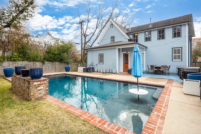 view of swimming pool with an outbuilding, a patio, and cooling unit